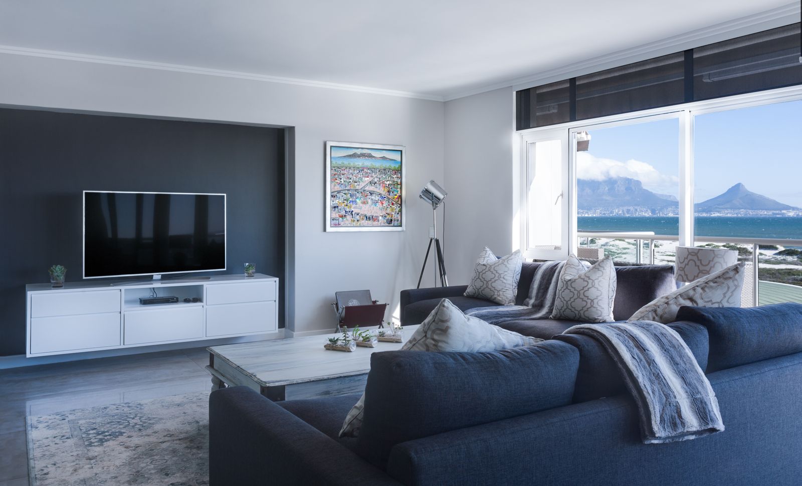 A television mounted on the wall of a modern living room