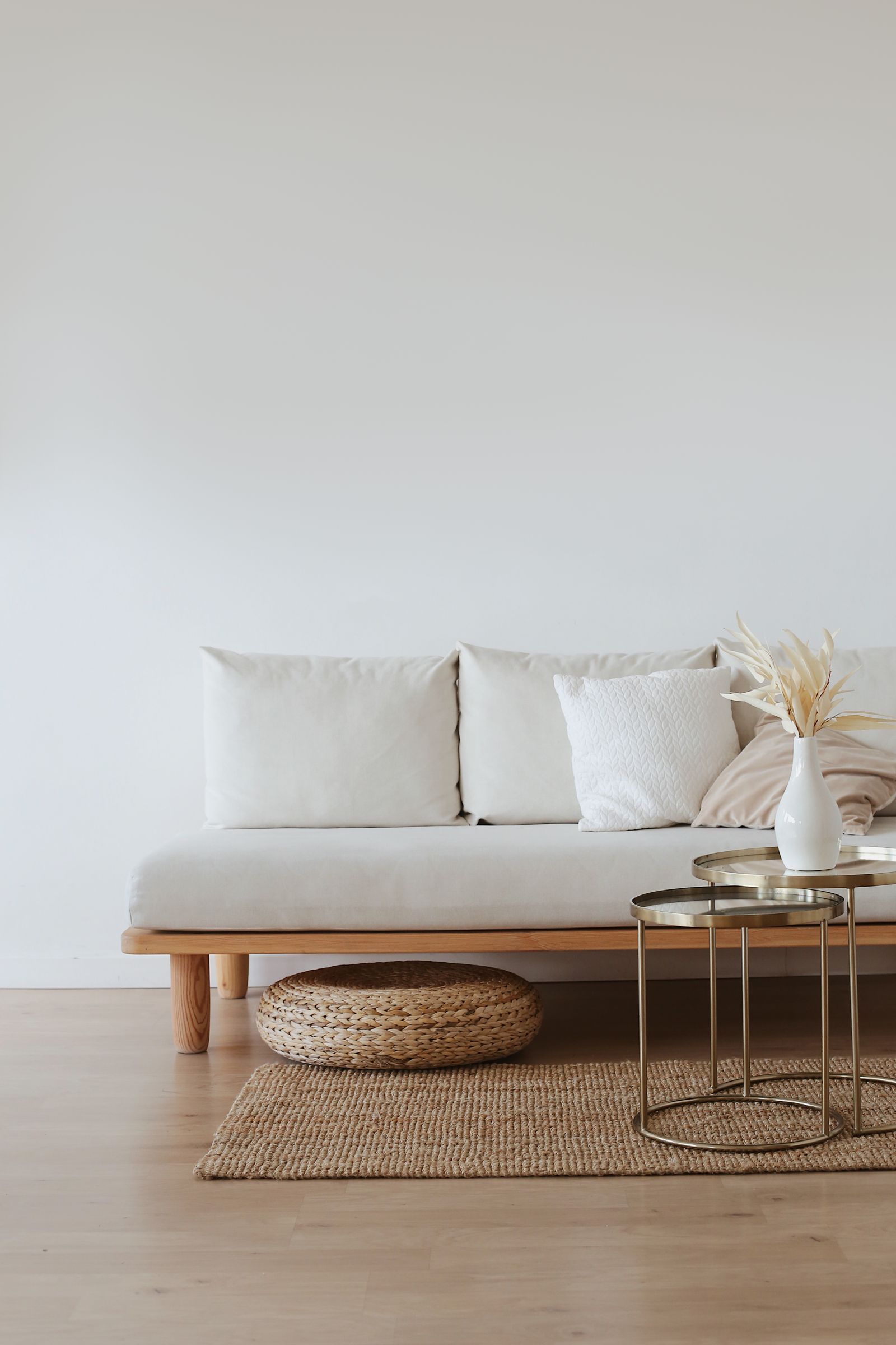 A bright living room with a neutral sofa and space for home technology