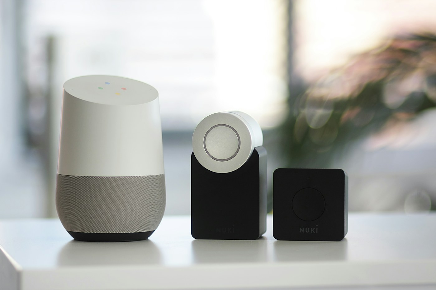 Connected home devices arranged beside a bright window